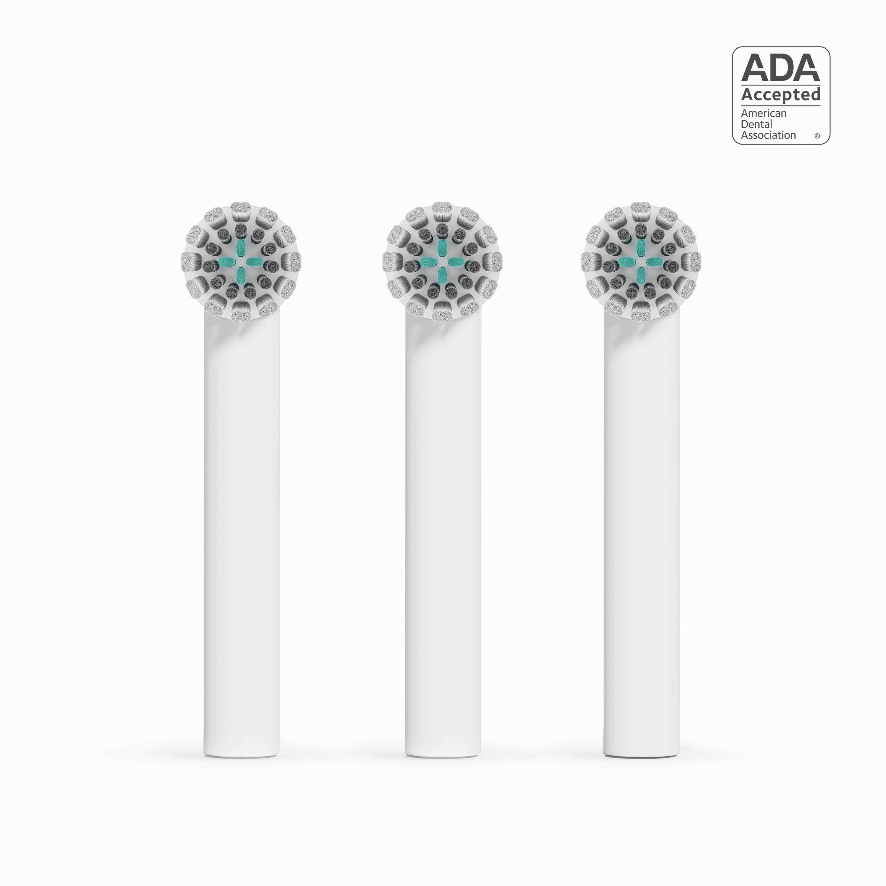 Three dental brush heads with ADA acceptance logo on a white background