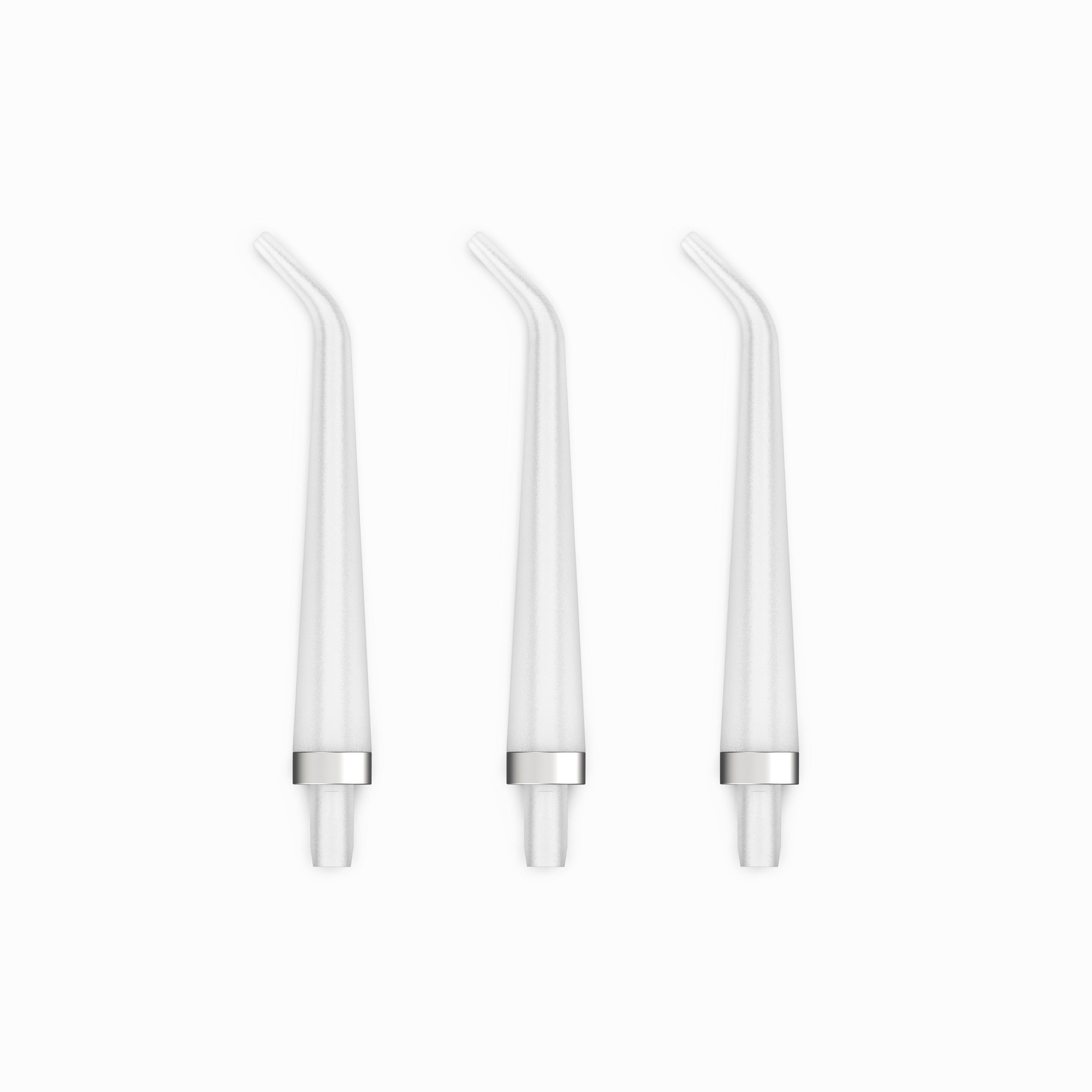 Three white straw-like objects on a white background