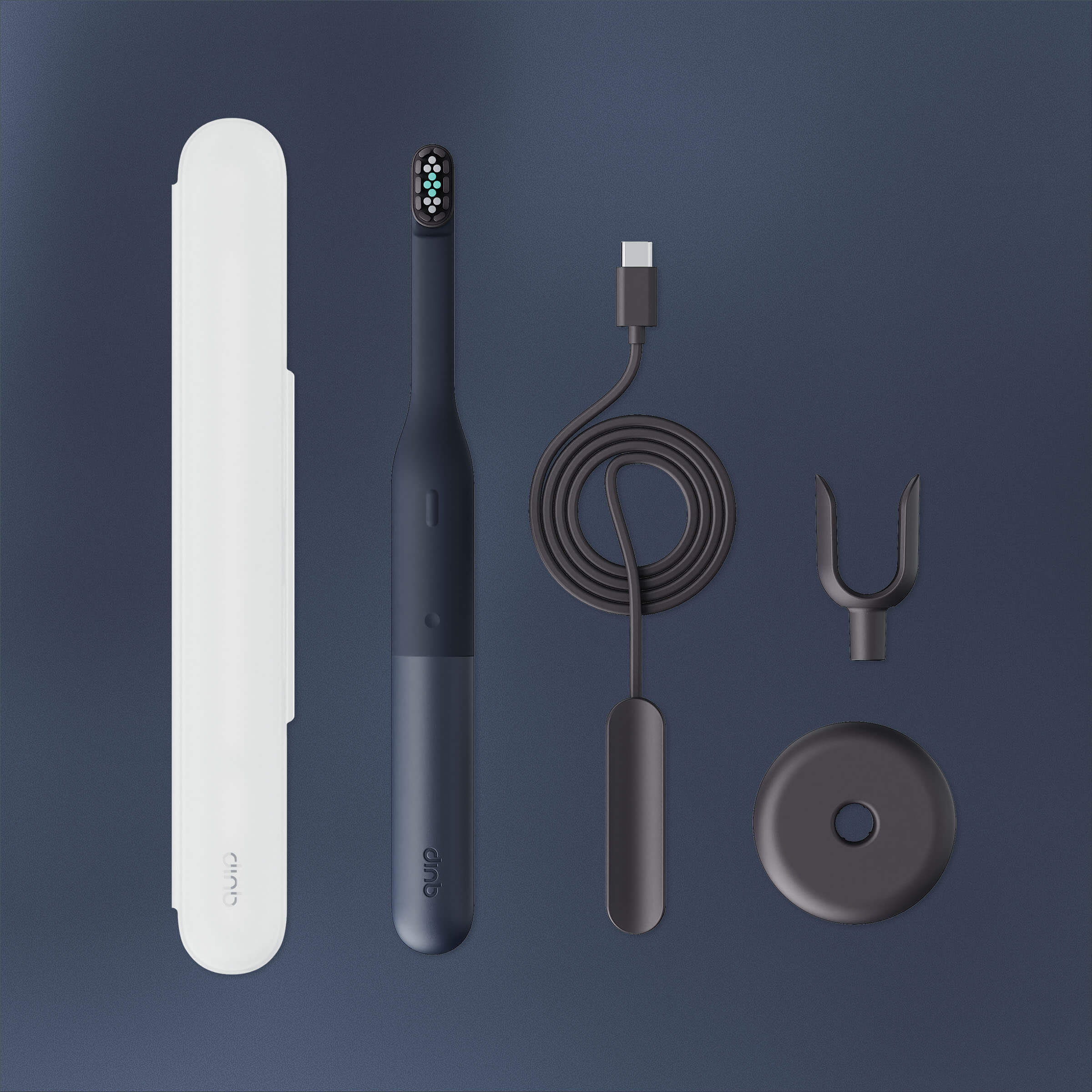 Collection of dental care products including a toothbrush, charger, and accessories on a dark background