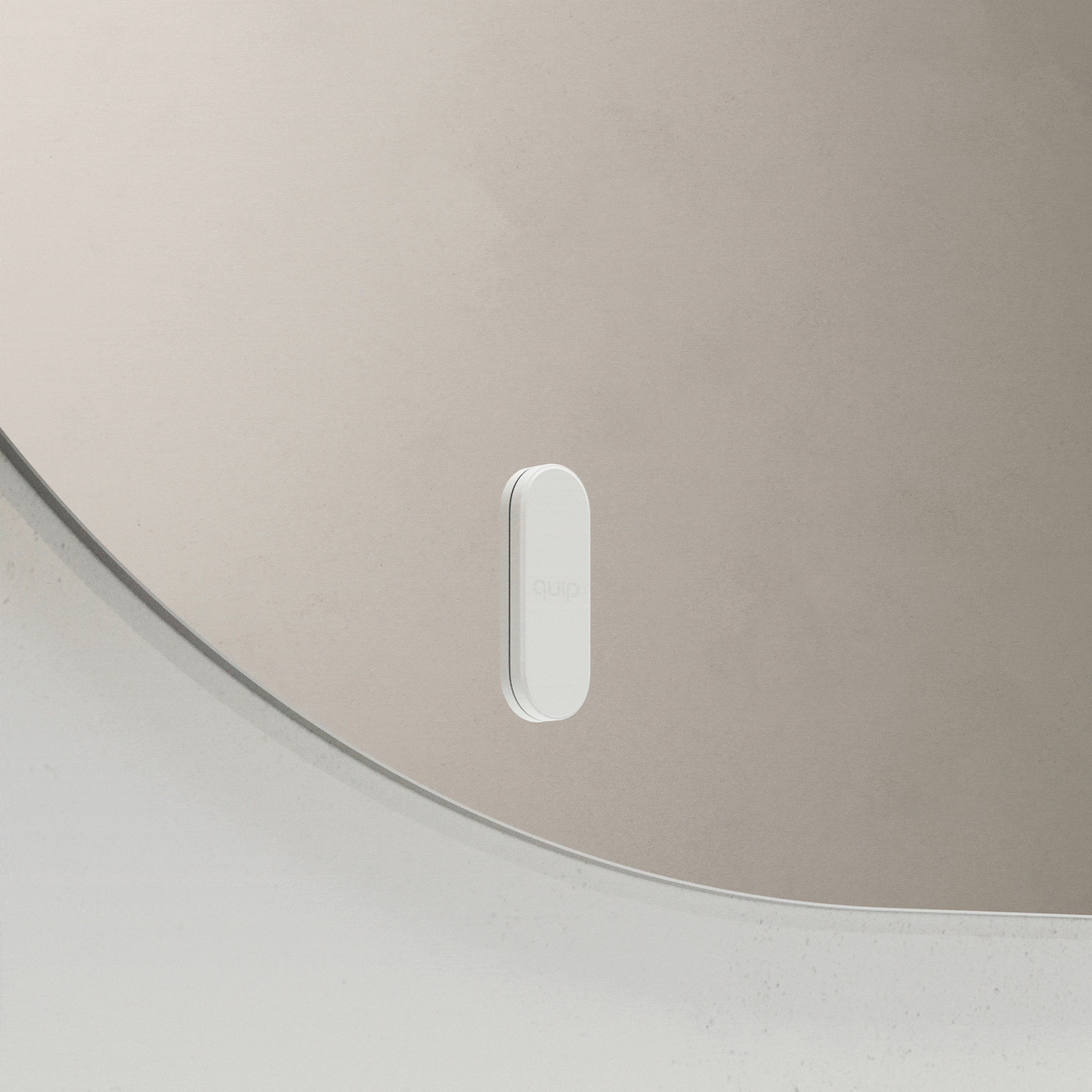 White quip toothbrush mount attaching to and releasing from a bathroom mirror.