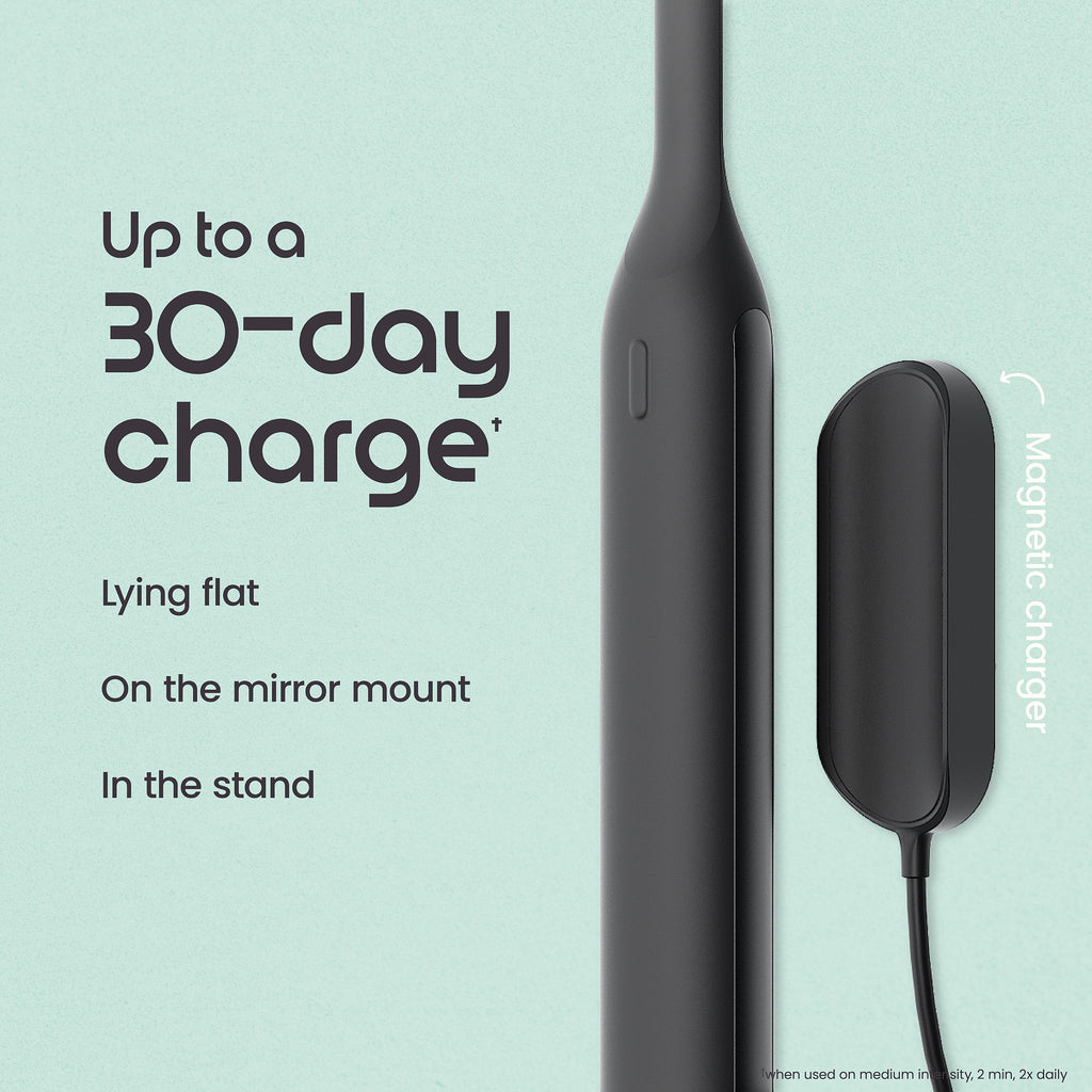 Black electronic device with magnetic charger on a light blue background, featuring text about charging capabilities.