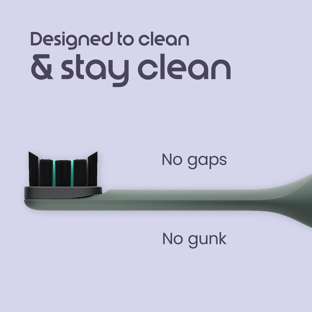 Close-up of a green toothbrush with seamless bristles and the text: “Designed to clean & stay clean. No gaps. No gunk.
