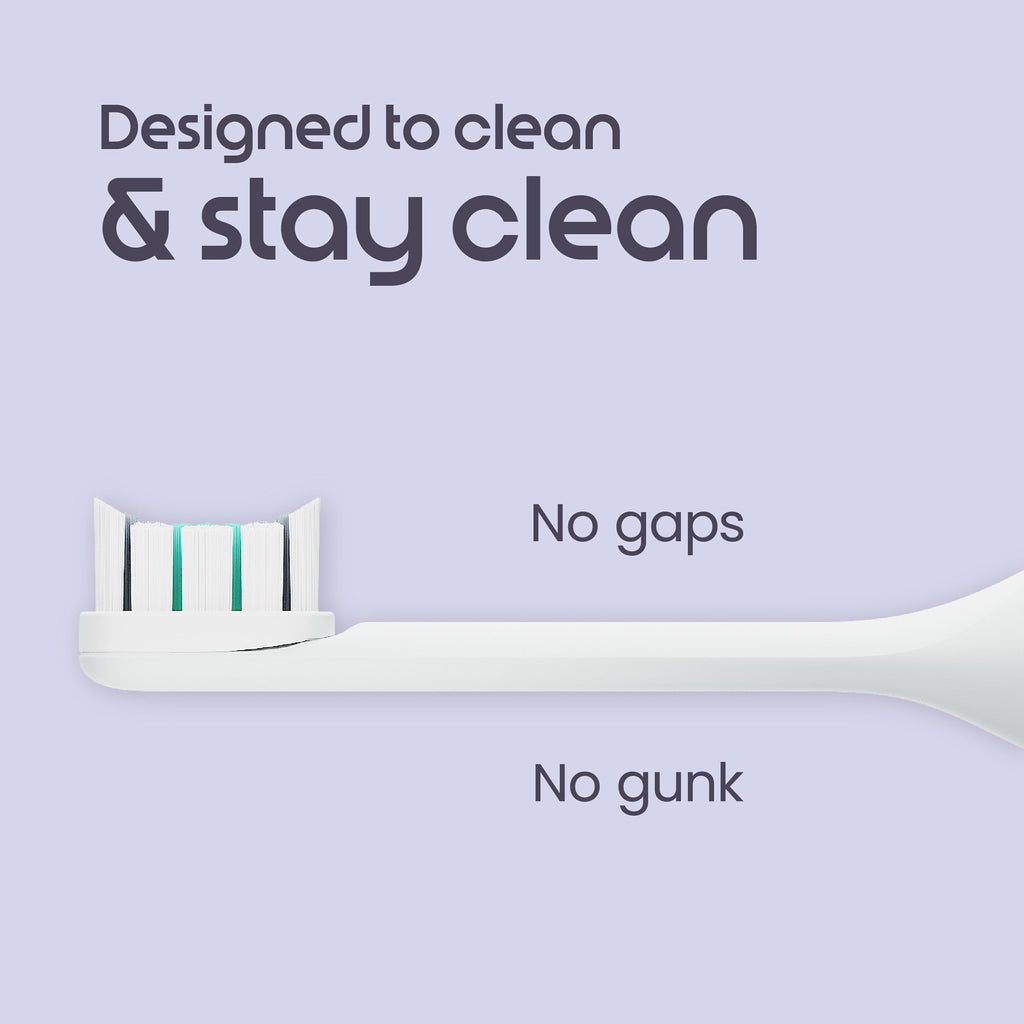 White electric toothbrush head with text on a light purple background