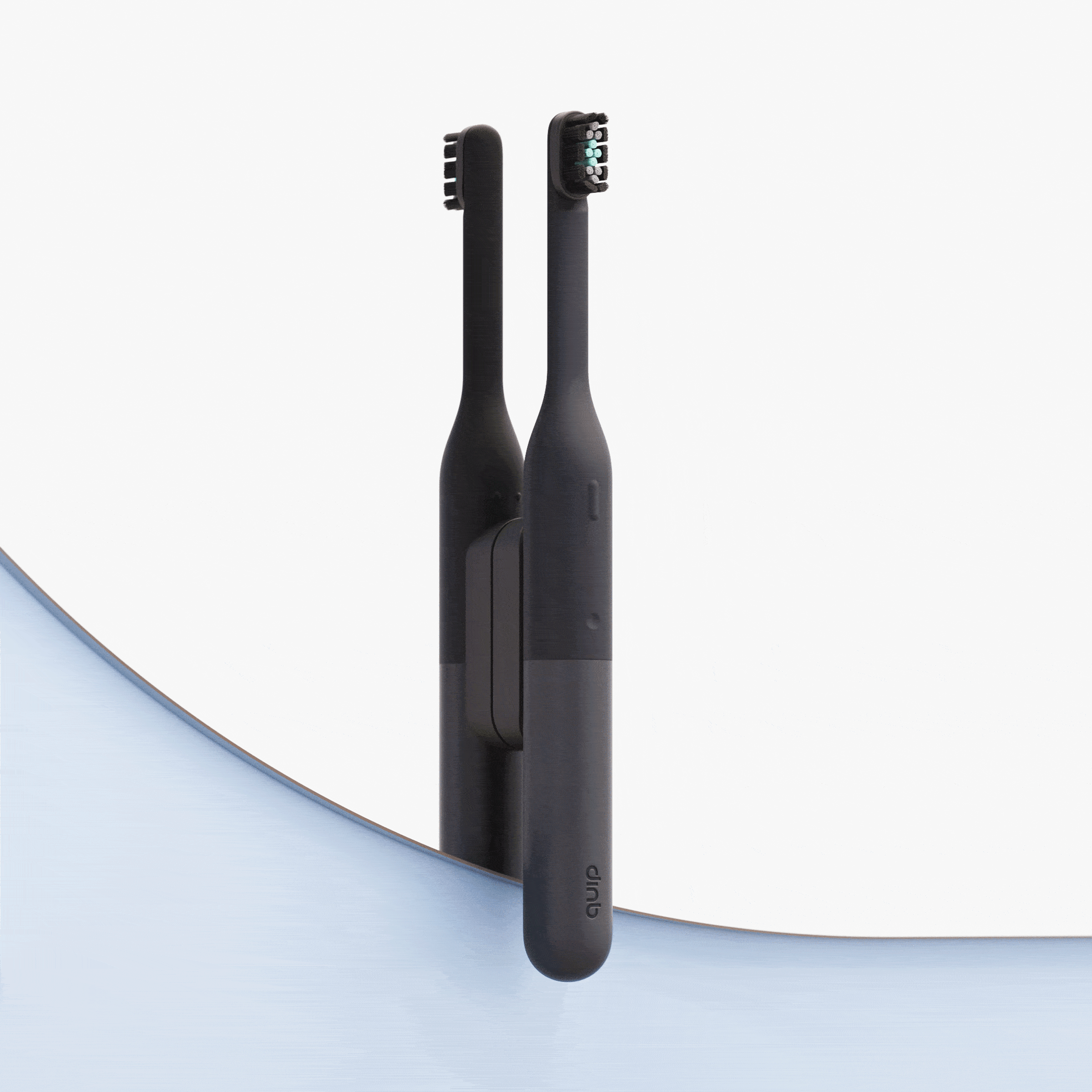Wall-mounted black electric toothbrush attached to a mirror, with its reflection visible, set against a clean, minimal background with a curved blue accent.