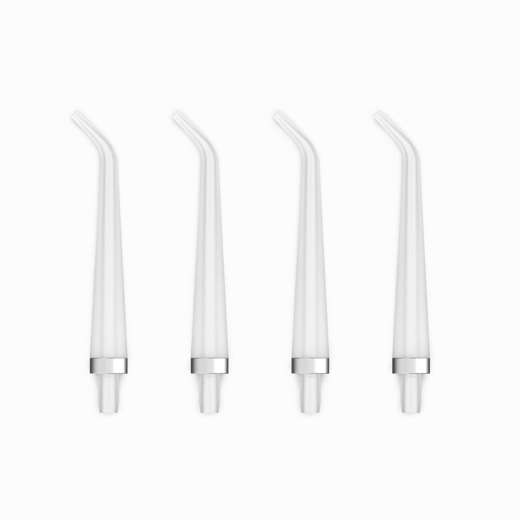Four white straws with silver bases on a white background