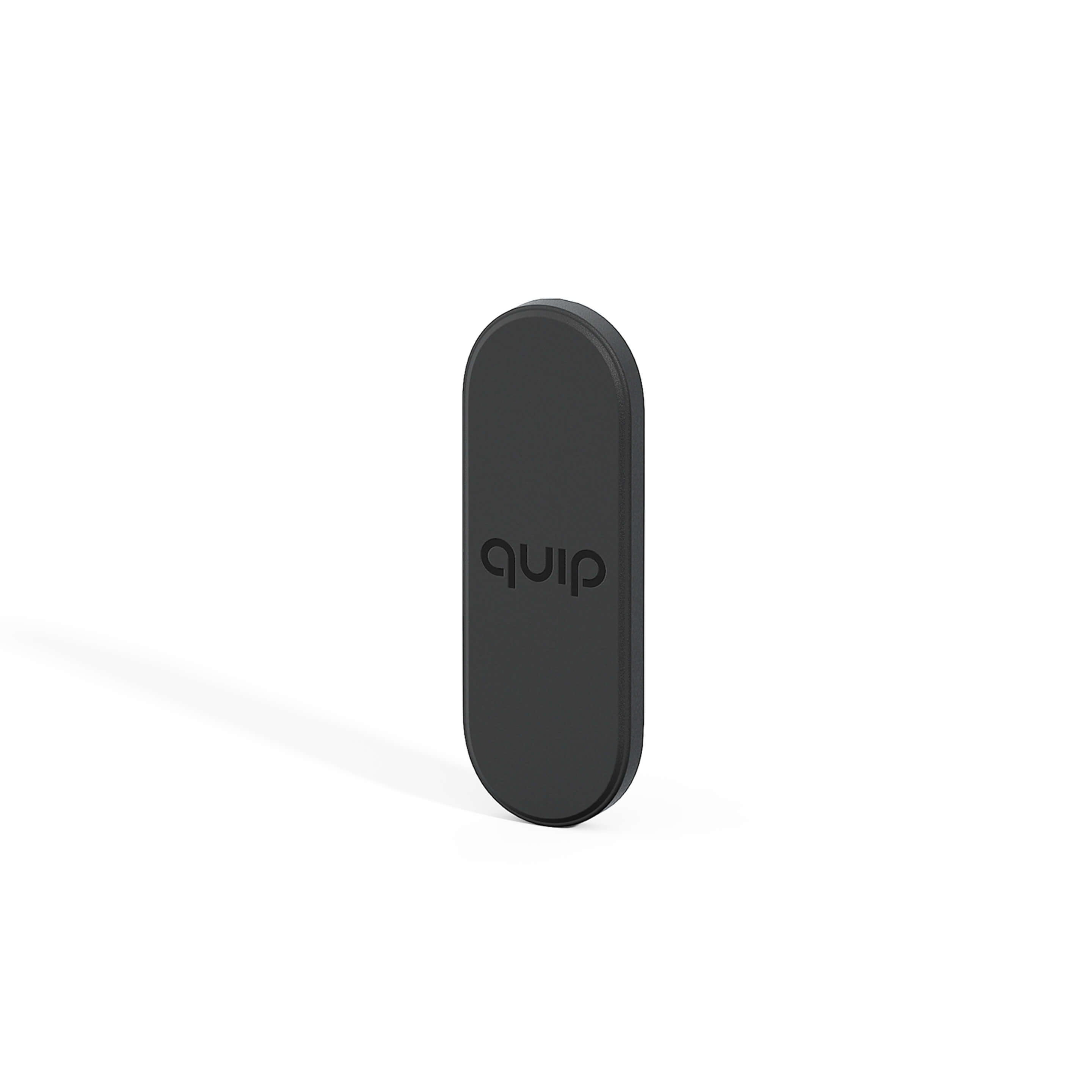 A black quip Ultra Mirror Mount designed to hold a toothbrush on a mirror or other flat surface.