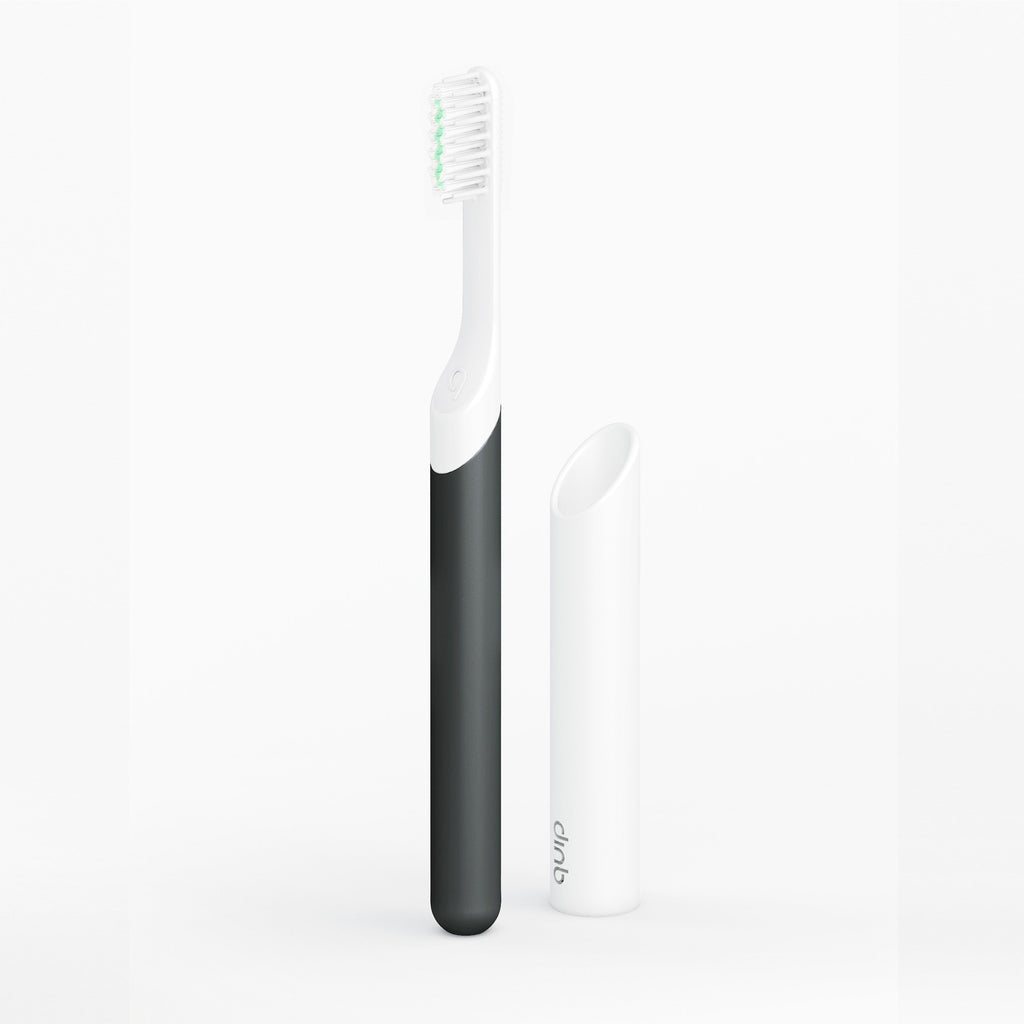 Black and white electric toothbrushes on a white background