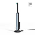 Black and silver electric toothbrush with charging stand on a white background, featuring ADA Acceptance logo.