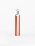 A rose gold colored refillable dispenser for floss string with a pop-up top.