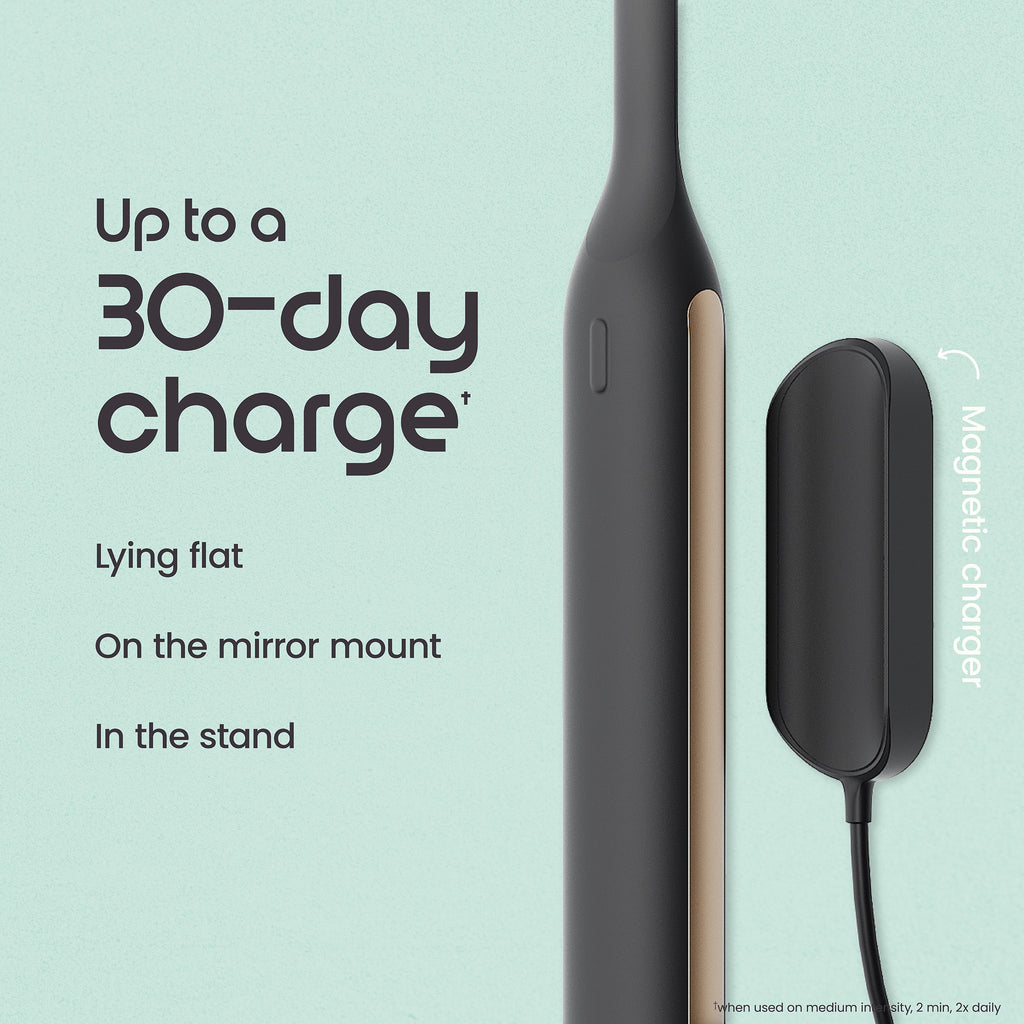 Smartphone with magnetic charger on a light blue background, highlighting charging capabilities.